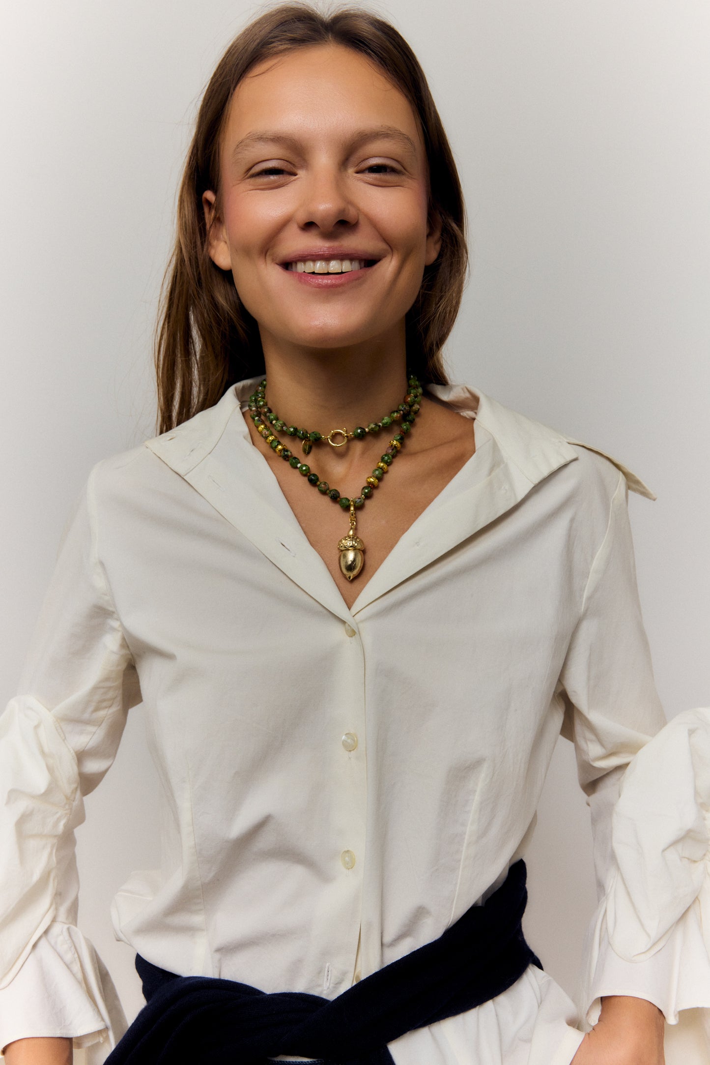 GOLDEN ACORN NECKLACE, LONG WITH DARK GREEN BEADS AND A BRONZE ACORN-SHAPED PIECE