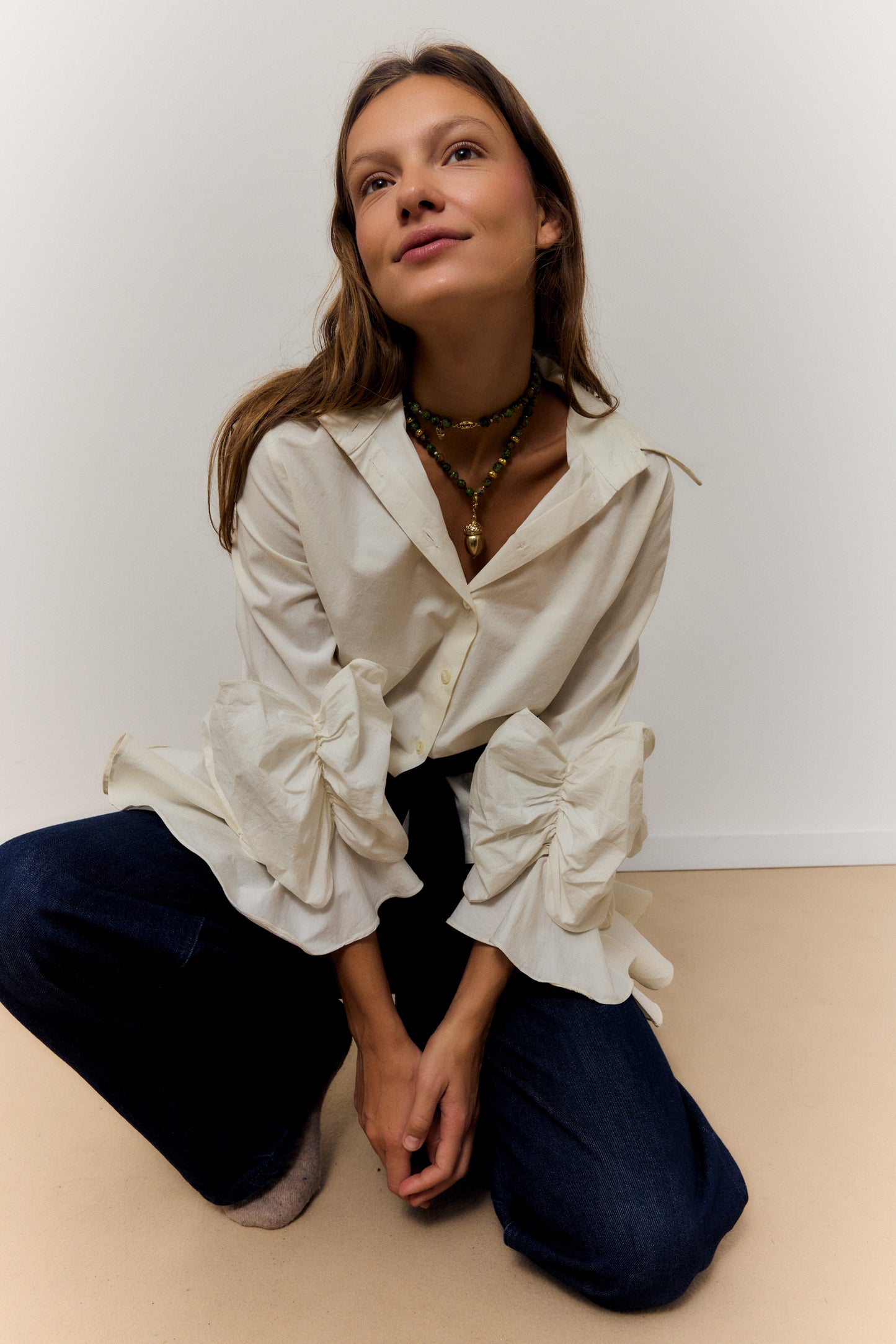 GOLDEN ACORN NECKLACE, LONG WITH DARK GREEN BEADS AND A BRONZE ACORN-SHAPED PIECE