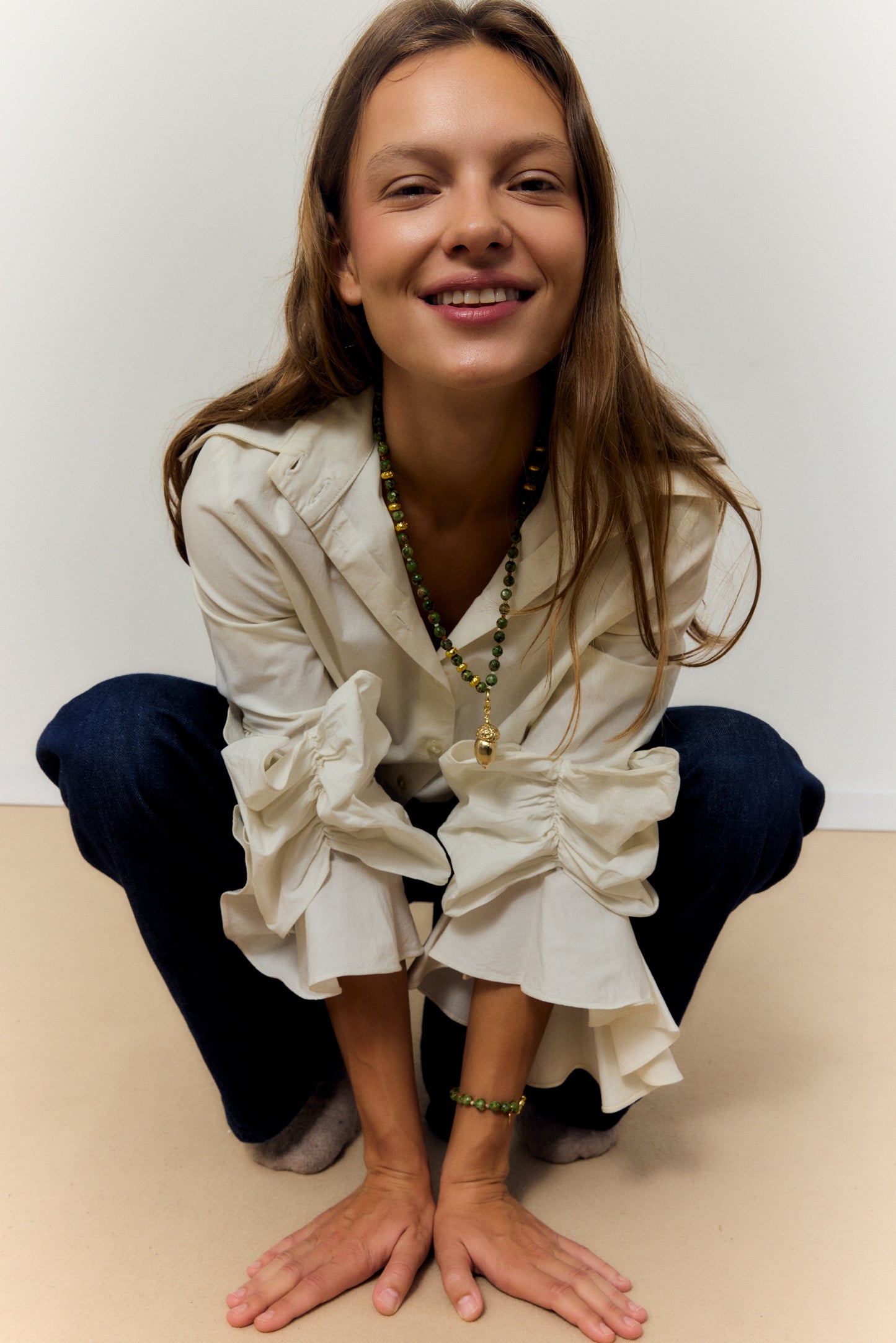 GOLDEN ACORN NECKLACE, LONG WITH DARK GREEN BEADS AND A BRONZE ACORN-SHAPED PIECE