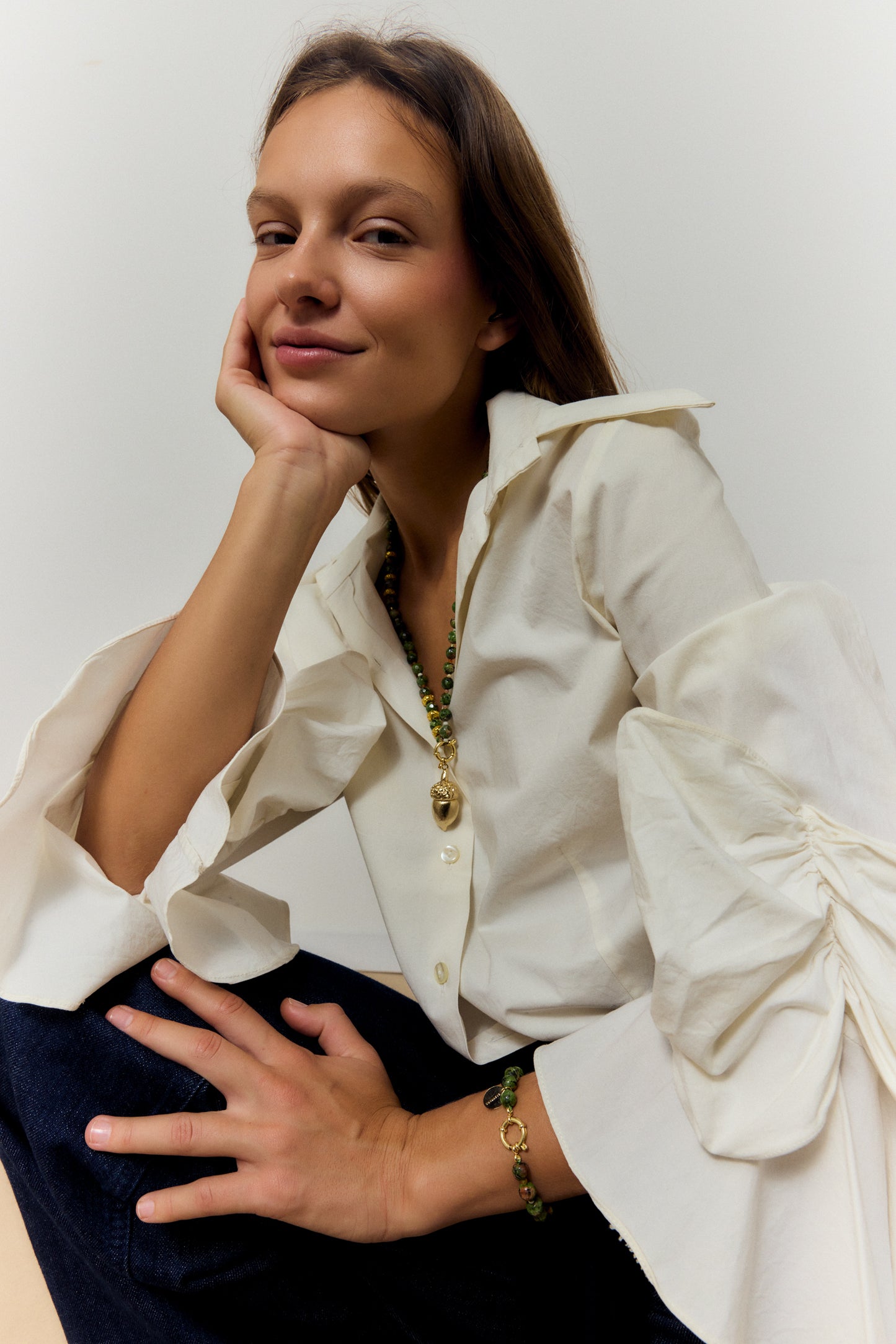 GOLDEN ACORN NECKLACE, LONG WITH DARK GREEN BEADS AND A BRONZE ACORN-SHAPED PIECE