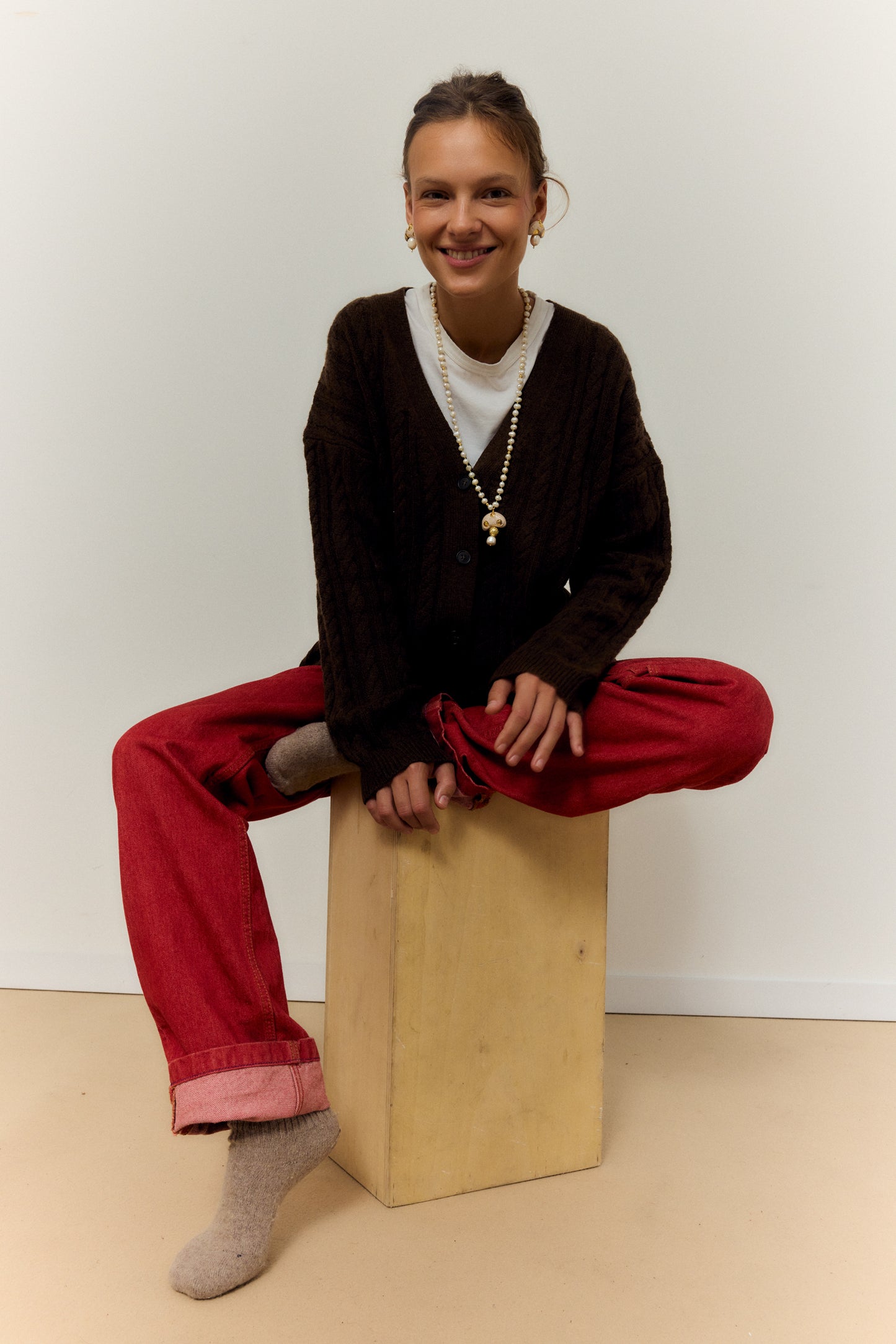 CHAMPI TOPO, LONG PEARL NECKLACE WITH BROWN MUSHROOM PENDANT.