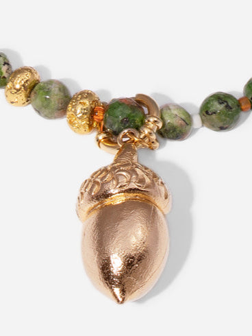 GOLDEN ACORN NECKLACE, LONG WITH DARK GREEN BEADS AND A BRONZE ACORN-SHAPED PIECE