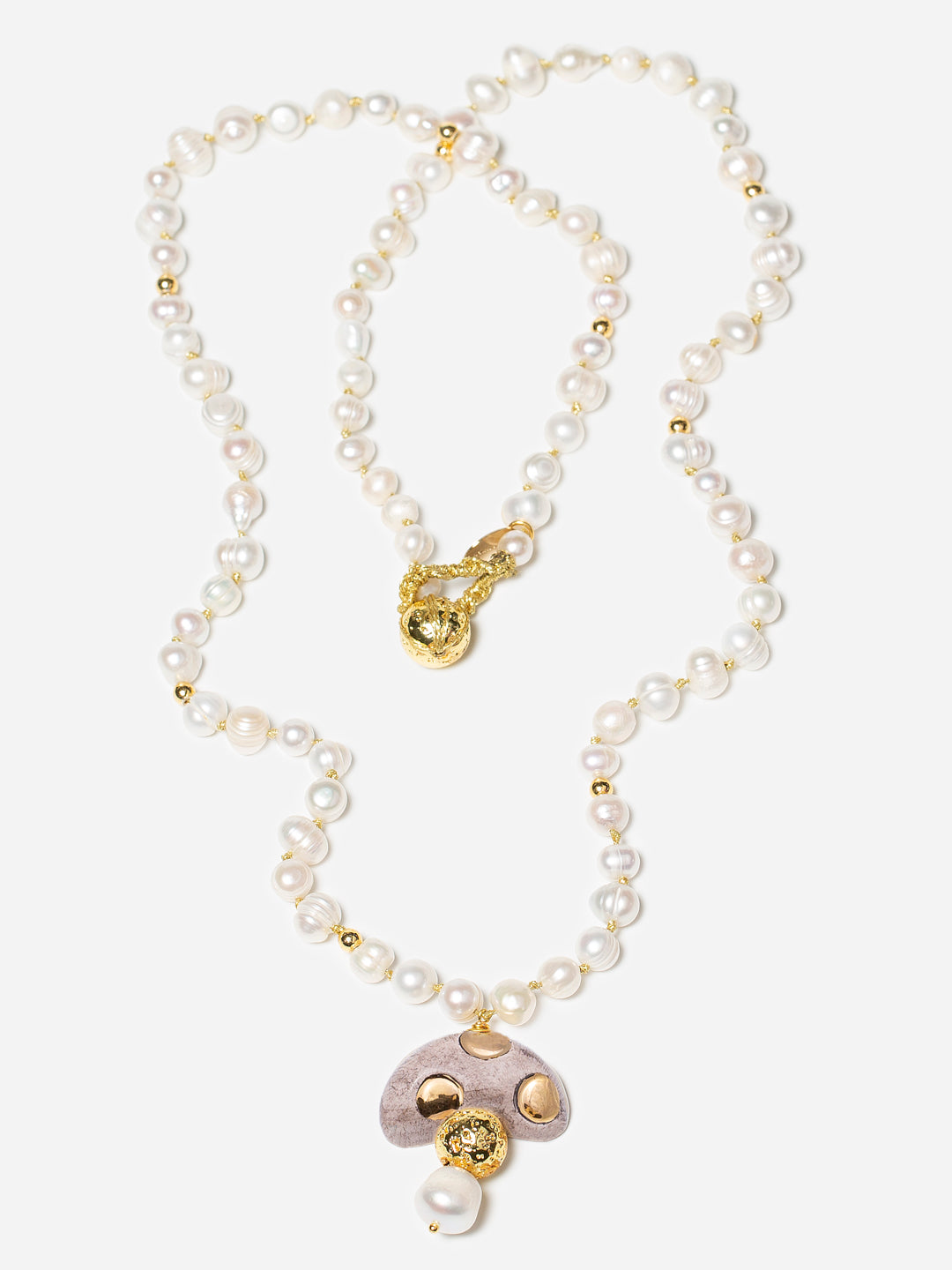 CHAMPI TOPO, LONG PEARL NECKLACE WITH BROWN MUSHROOM PENDANT.